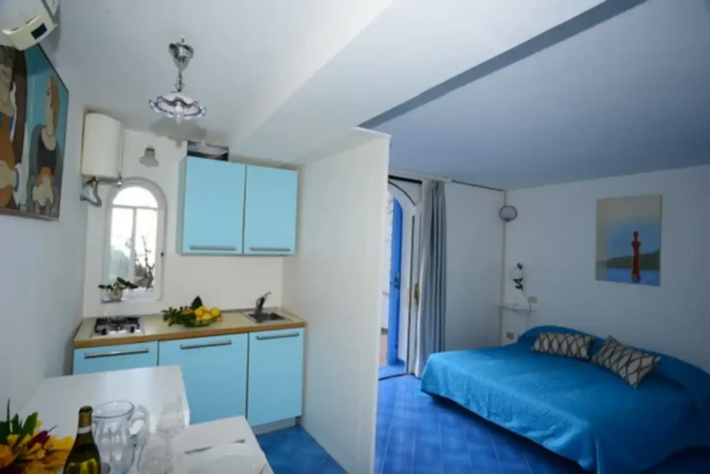 Casa Bellina Letto matrimoniale e cucina